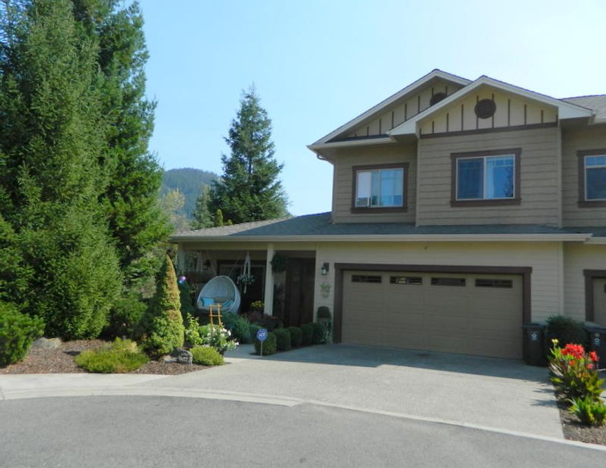 Move in Ready Townhouse in Sequoia Village.  End Unit on Cul-de-sac with backyard opening to Common Area.  1666 sqft 3 bdrm 2 1/2 bath built in 2007. Great Room with fireplace and opening to covered patio and spacious common area.  Kitchen with Granite counters and large pantry,  Master on main floor with newly tiled shower.  Two bedrooms and bath upstairs with Deck over looking development.   Many up grades:  Cork Flooring, Tankless water heater, new carpet, new paint. new light fixtures.  Guest bath on main floor. Awesome private patio w/ Pergola, cover BBQ pad.   HOA fee is $75/month for Clubhouse, pool, common area and front yard maintenance.