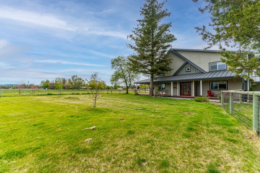 Lovely, spacious home on Tumalo acreage with a charming pond, multiple shops & barn! This inviting property features an open floorplan with abundant windows & new
glass doors that open onto a wraparound porch, creating a special connection with the beautiful setting. Enjoy the mountain views from the bucolic setting with 2.5 acres
of Swalley irrigation. The main level has a large kitchen & great room, ideal for entertaining. The home has a gracious master suite with newly remodeled, spa-like bathroom and two guest bedrooms upstairs. Additional guest quarters, full bath and large bonus room with separate entrance are on main level. With a den, living room, sunny
great room & even a gear room, this house has space for everyone! Large shop for your projects and adorable barn for true country living, yet close to town & shopping...come live the Central Oregon dream!