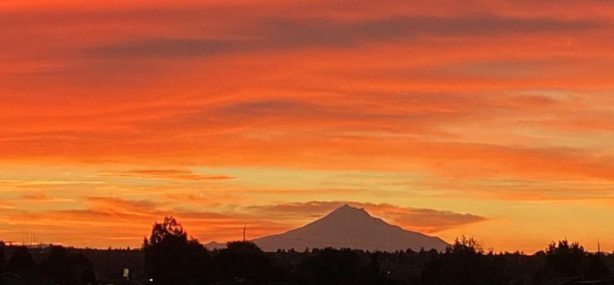 Fantastic views of Mt. Jefferson out your back door! Built in 2021 with luxury finishes throughout! This 1,810 sq ft single-story home with 4 bedrooms, 2 bathrooms on .19 of an acre with  A/C & RV parking! Lightly lived-in with a tile entranceway that opens to a large great room with a natural gas fireplace & hardwood floors. The kitchen has a sizable island, a custom pantry, granite countertops, and stainless steel appliances. The roomy primary suite has a large walk-in closet, oversized shower stall & granite countertops. All windows in the home are trimmed granite! Brand new backyard landscaping & sprinklers. Call your real estate agent today!