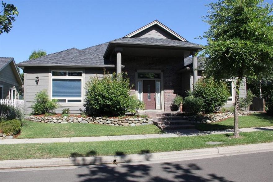 Beautiful home located in a prime Central Point neighborhood. Built in 2005 this single level 2369 sq. ft. home has many upgrades. The center of the home is the spacious great room with a gas fireplace and custom mantle plus coffered/lighted ceilings. Fabulous gourmet kitchen with granite counter tops, stainless appliances and upgraded hardware and lighting fixtures. The large master suite has walk in closet, jetted tub and double sinks. The 2 additional bedrooms have plenty of space for family or guests. As a bonus this home has a wonderful atrium to relax in with sky lights and french doors. The home has central vacuum, is wired for sound and has an alarm system. The large finished garage has a drop down ladder to access all of the the additional storage. The yard is fully landscaped with mature plantings and in ground sprinkler system plus a patio to sip coffee in the morning or BBQ in the evening. This IS the home you are looking for.