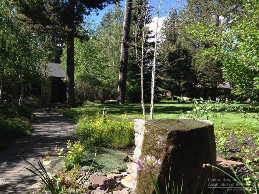 One of a kind Central Oregon mini-estate. 3+ acres immediate on the Deschutes River. Cascade Views, 200+ ft. of river frontage, grandfathered dock. Lovingly remodeled in 2002, new roof. Radiant heated, wood burring fireplace, hot tub, greenhouse, fully landscaped. 1.5 acres of irrigation with land, 2 more available for purchase.