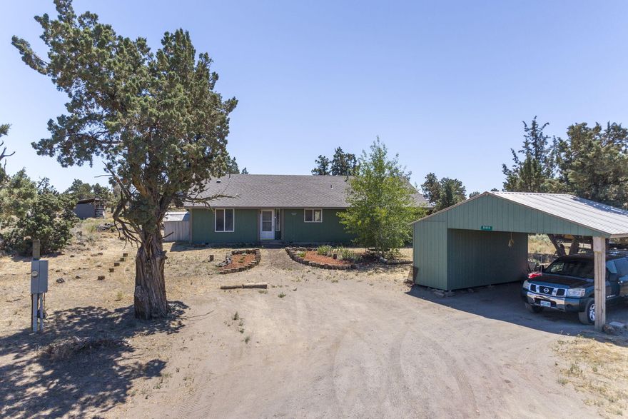 Don't miss your chance to own this one level home on 4.91 acres near Bend. Well maintained home with great room floor plan and room separation. Primary bedroom (14.5 x 13) with updated primary bath featuring deco tile floor, single vanity, shiplap detail and subway tile step-in shower. Kitchen boasts breakfast bar, kitchen appliances (included), and pantry closet. Large 15.5 x8 laundry room with washer/dryer included. Spacious back deck. 3 Livestock shelters. Car cover is included. Partially fenced. Shared well. Located close to government lands. Old growth Junipers on the land. Covered carport with storage. Call for your showing today!