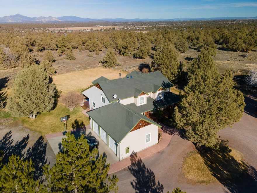 A true treasure awaits, offering both comfort and privacy in a gorgeous rural setting, with close proximity to town! You'll first fall in love with the elegant custom-built home that is substantial in size, natural-lit rooms, and numerous quality finishes. The spacious kitchen has newly refurbished cabinets and built-ins with brand new, stunning acacia butcher block counter tops that perfectly compliment the updated appliances and travertine stone flooring. The outdoor spaces are perfect for entertaining-a peaceful water feature, fruit trees, gourmet herb garden on a drip system, as well as a gorgeously lit, wrap-around back porch to create a dream home backyard setting! The clean and tidy ADU, storage shed, professional dog kennel, and six-stall horse barn complete with tack room and chicken coop offer the full country living package. The property sits adjacent to 32,000+ acres of vehicle-prohibited BLM land (no atv's) and a resort bike trail with access just outside the back door!