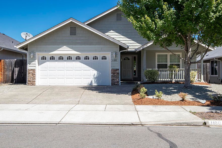 This well maintained home was built in 2005 and features a newly refreshed yard and new appliances -- it's ready to sell! With 3 bedrooms and 2 full baths, this 1364 square foot home is located in a quiet cul-de-sac, but is just minutes from shopping, medical facilities and several parks. The home begins with the Great Room, which is open and bright with vaulted ceilings, ceiling fan and lots of windows for natural lighting. The open kitchen has an island and an eat-in bar which separate it from the Great Room; the dining area has a sliding door which leads to a private covered patio in the back yard, which is wonderful for entertaining.  From the great room, a hallway leads past two smaller bedrooms to the spacious bedroom suite, with a private bath and walk-in closet. The property is finished off with a low maintenance back yard that is completely fenced for privacy and safety, while the front yard features a covered porch and mature landscaping.