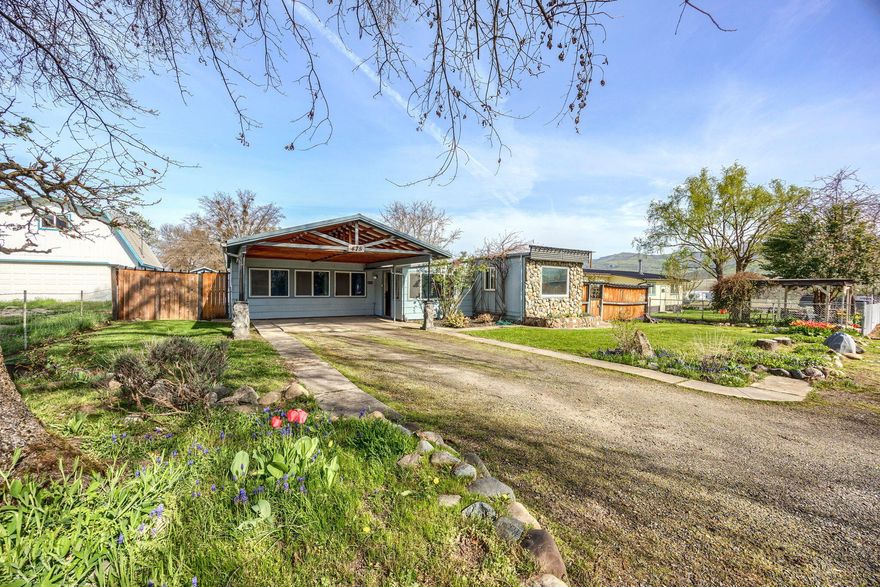 Great opportunity in the heart of Talent! Big 1,742 Sq Ft Home, featuring 3 bedrooms, 2 bathrooms, 2 living areas, a bonus room and a large fenced back yard. This home has a wood burning stove, laminate flooring, built-ins, and unique custom features. Outside there is also a covered patio that nearly extends the length of the house, a stick built garden shed and great privacy! HVAC system only one year old! All this is just about 100 yards away from Kamerin Springs Park!!