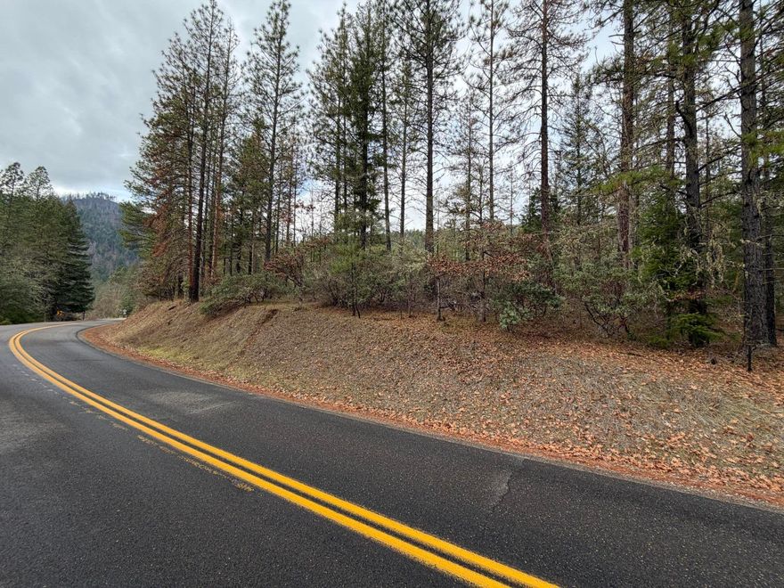 Wooded 4.36-acre hillside parcel off E. Evans Creek Rd. in rural Southern Oregon, offering privacy, scenic views, and mature fir, pine, oak, and other native trees. WR zoning may allow a homesite; buyers are responsible for verifying zoning, permits, and intended uses with Jackson County. Convenient paved road access and within easy drive of White City, Rogue River, and Eagle Point. Neighboring 3.60-acre parcel from the same seller is also available, providing an opportunity to combine for expanded acreage.