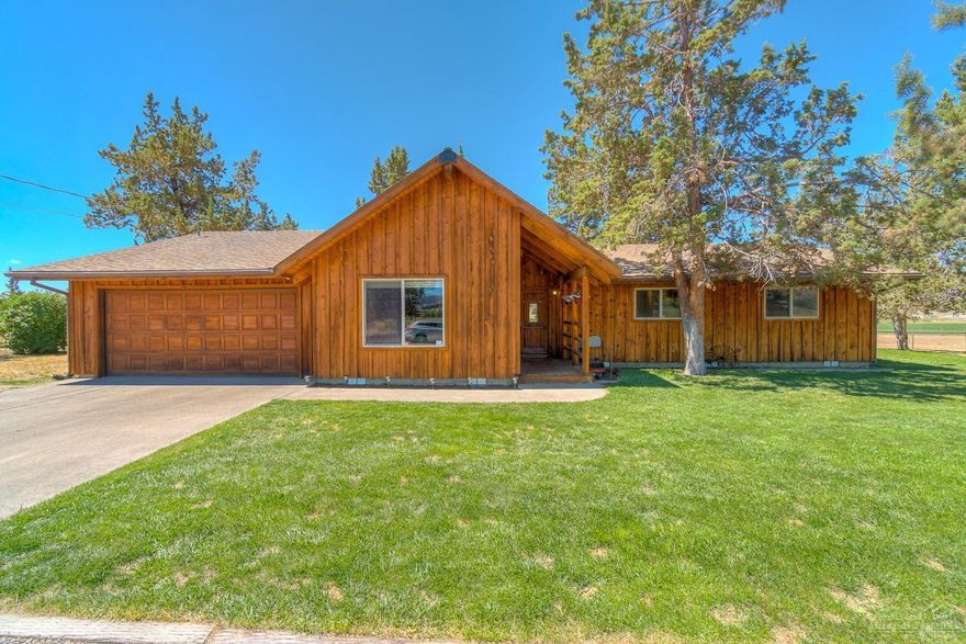 Nestled in the canyon, enjoy amazing views of Smith Rock from this 5+ acre property. Home has rustic charm w/natural patina'd board & bat exterior & blue buggy pine accents. Single level home w/cozy covered entry, large vaulted family room, farm style kitchen & central living area. Guest bath has all new finishes, great mud room & attached 2 car garage. 35x60' shop w/220, 15' doors, 200 amp service. Property can be irrigated & arena can be planted. Chicken coop included. On a dead end road w/ private well!