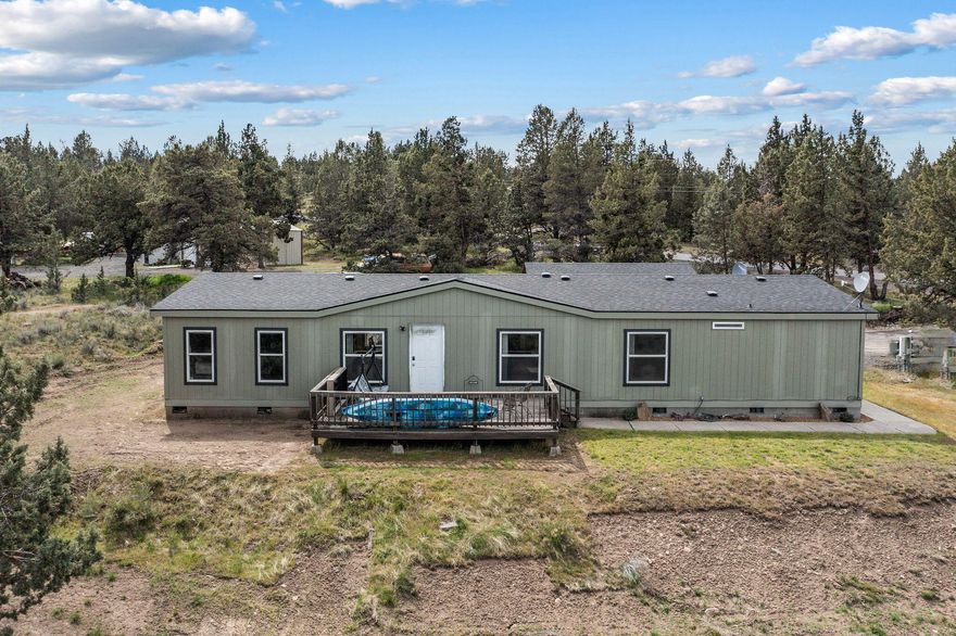 Great home with 4 bedrooms and 2 bathrooms. This property boasts an open floor plan with vaulted ceilings, offering a spacious and inviting atmosphere. The large kitchen provides ample storage space, perfect for culinary enthusiasts. Enjoy the combination of laminate and carpet flooring for a cozy feel throughout. The private primary bedroom features a walk-in closet and a newly renovated master bathroom. Situated on 1.99 acres, the fenced backyard offers privacy and room for outdoor activities. Relax and entertain on the large front deck or the delightful concrete patio in the back. With a 2-car garage wired with 220 for versatility and equipped with a mini split, comfort is guaranteed. Located close to town, this property offers convenience and accessibility to nearby amenities. Don't miss the opportunity to make this your dream home!