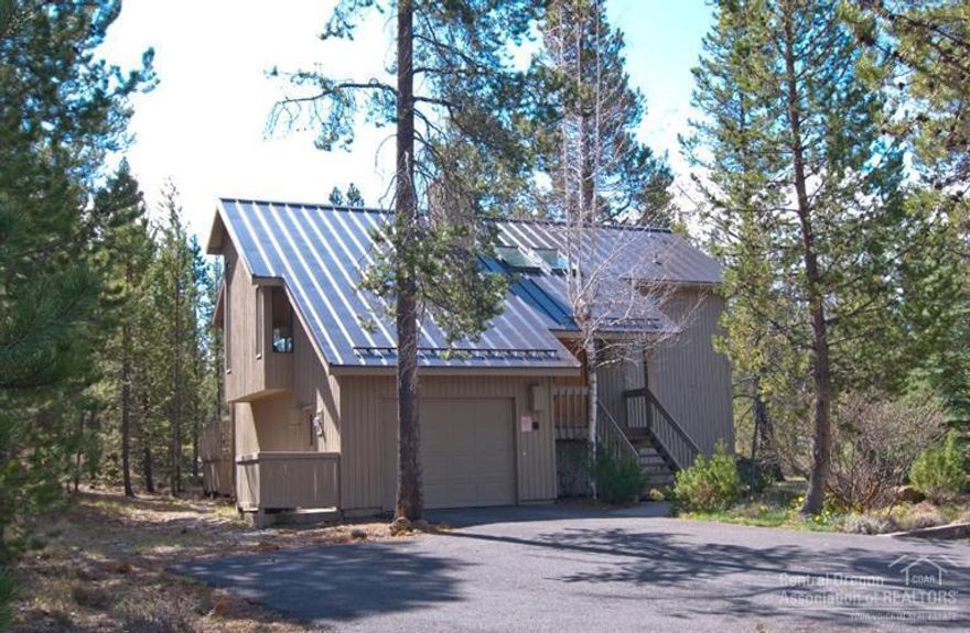This is a great house in the center of Sunriver. The home sits on a large 1/3 acre lot with 3 bedrooms, 2 full baths, nice size great room with a wood stove and a large back deck facing south for sunshine all year. The kitchen has been updated with granite counters and stainless appliances. The upstairs shower has been nicely redone and the metal roof is new. This home comes turnkey furnished and has a strong rental history. Be sure to watch the walk through video attached as a virtual tour.