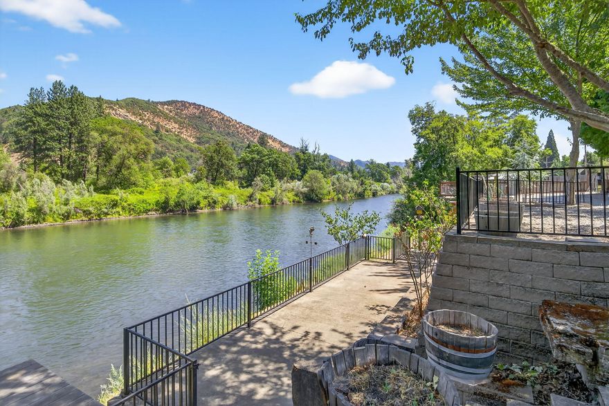 Gorgeous Recreational River Lot on the scenic Rogue River. Features room for two RV's each with their own electrical panel. Approx 94 feet of River Frontage. Beautifully landscaped with multiple patios for enjoying the scenery. Steps for easy access to the river. Privacy fencings, Large Carport. Hurry this beautiful lot will not last long. Well, power, cable and holding tank for sewer. and fruit trees too much to list. Adjacent property 5504 Rogue River Hwy available also for 185,000.00