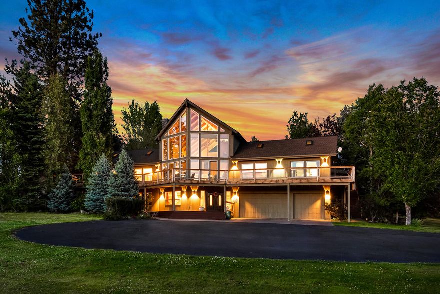 Absolutely stunning, resort-like Luxury Hobby Farm w/panoramic Cascade Mountain views on
18+ manicured acres w/ majestic old growth trees and 11 acres of irrigation. Three level
custom home features a dramatic great room, two story river stone fireplace, soaring ceilings,
wood accents and walls of glass. Main level updated kitchen and dining area open to a beautifully
landscaped paver patio, pool and backyard w/waterfall. Two separate guest wings each with two bedrooms (or
offices) and bath and outdoor access. Upstairs primary suite has luxury
remodeled bath and spectacular views. Downstairs bonus room has a cozy sitting area, theatre
space, wet bar and bath - perfect for multigenerational living. Property includes a 2 bed/ 2 bath permitted detached guest apartment that 
sits above a 6 car RV garage/shop w/ hook ups.  So much Equestrian potential! - loafing shed,
irrigated paddocks, trails, close to BLM, room for arena.  Wonderful location, close to schools, hospital and shopping.