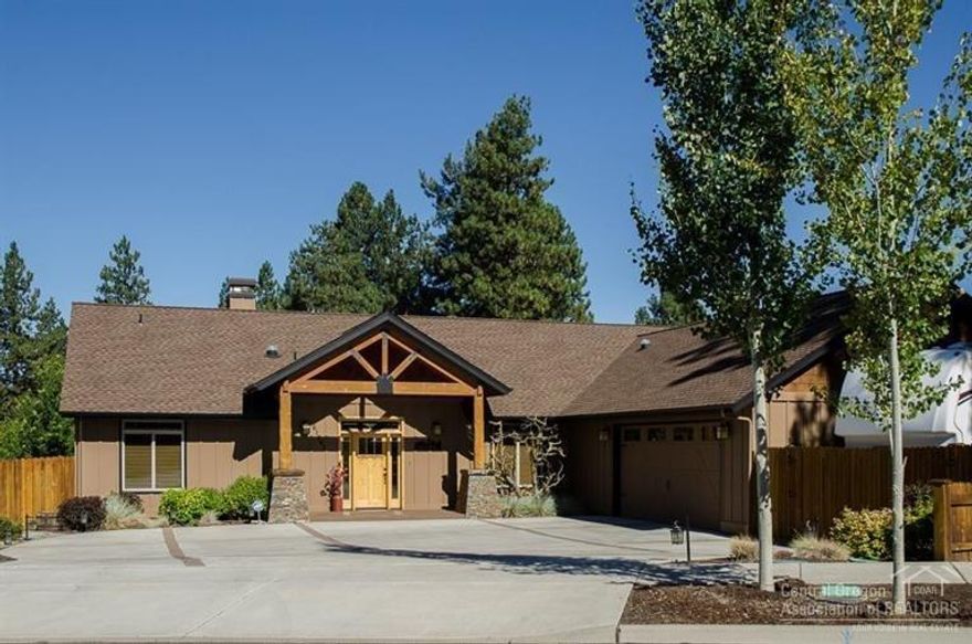 Spectacular 2,209 sq ft custom home on the canal in beautiful Ladera neighborhood. This 1-level 3BR 3BA lodge-style home lives much larger than many bigger homes. Huge 3-car garage w/extra shop space, RV parking w/plug-in & a low-maintenance yard with no lawn to mow! Vaulted wood ceiling, hardwood flrs & stacked-rock fireplace in great room. Chef's kitchen w/granite countertops & tile backsplash & tons of custom cabinets. There is exceptional quality everywhere you look! Ask for list of all the upgrades!