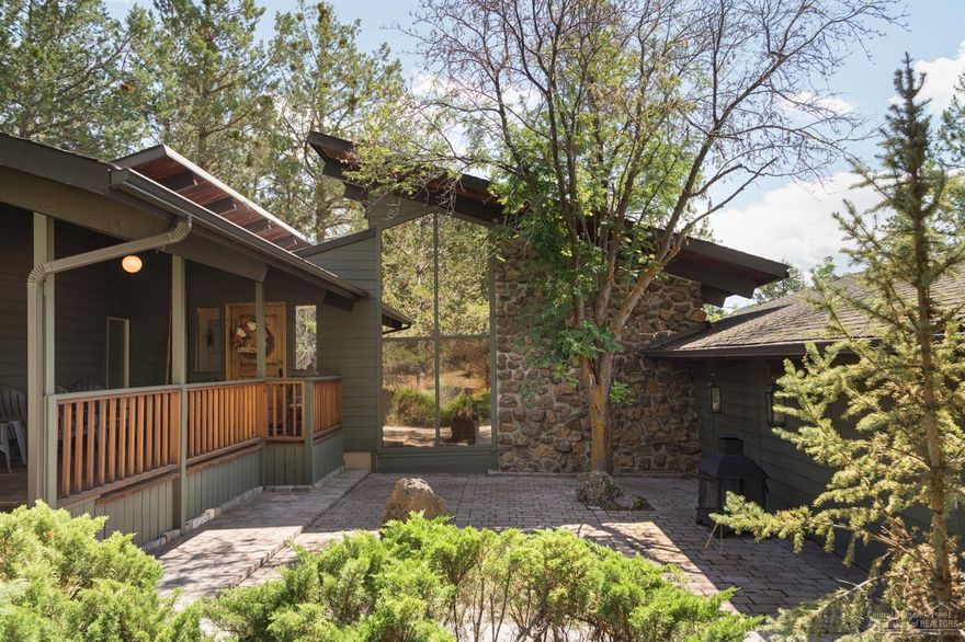 This unique Mid-Century home is in the desirable Rim Rock Village on Bend's westside. Situated on over an 1/2 acre lot with mature landscaping, this 3 bed/2 bath 1576 sq ft single level home is full of character and charm. Vaulted wood ceilings throughout, sunken living room with an impressive rock wall, engineered wood floors, cute updated kitchen, recently updated bathrooms and plenty of windows bring the natural light in. Outside you'll find a covered front porch, a paver patio perfect for entertaining and a big deck out back. This property has RV parking as well as two double car heated garages. The Rimrock Village neighborhood is close to the Deschutes River just minutes from this unique home!