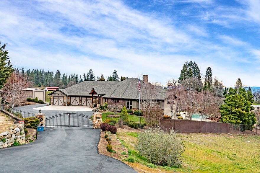This Northwest Craftsman-style home has something for everyone! Prime location 15 min. from Medford. 5 irrigated acres. Spectacular views of snow-capped Mt. McLoughlin and surrounding areas.  Salt-water pool. Impressive custom amenities such as hickory floors, knotty alder doors and cabinets.  2 garages that can park up to 11 vehicles.  Plus 18 x 40 RV Barn.   Great room - vaulted ceiling, fireplace, entertainment center.  Office - built-in desk and cabinets. Kitchen - granite island w/ eating bar, nook, walk-in pantry, wet bar with wine refrigerator. Master Suite-dramatic vaulted ceiling, unique gas fireplace, shower, soaking tub and huge walk-in closet. 2 guest rooms one w/ own bath. Craft Room/bonus room has multiple uses inc. potential 4th bedroom w/ adj. bath. Utility room w/ sink, lots of cabinets. Covered deck w/ BBQ, fire pit & hot tub. Fenced w/ Security Gate. Beautifully landscaped.