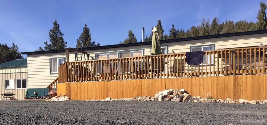 On 5.7 Acres. Home has 1488 Sq Ft plus kitchen update with hickory cabinets. 3 types of heat, private well, detached double garage, with a large RV shop 726' sq ft. Off grid with solar power/generator.