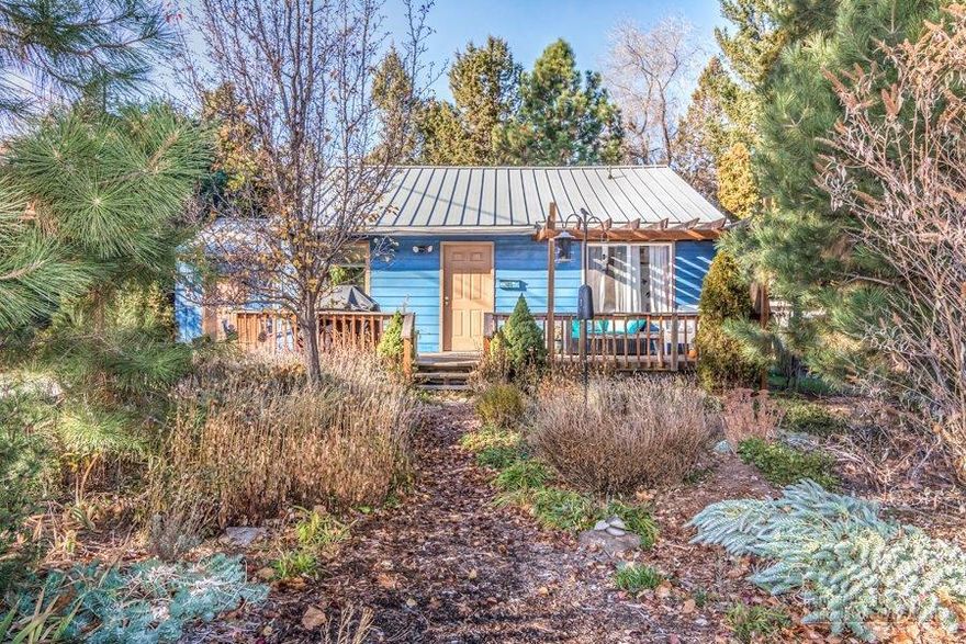 The location of this cute cottage right in the middle of Midtown could not be more perfect! Zoned RH, this home sits next to Juniper Fitness and its grounds, and is close to restaurants, coffee shops and Pilot Butte. This light-filled home has original hardwood flooring in living, dining and bedrooms, and a completely remodeled bathroom with granite counter top. Don't miss the attached bedroom with large full bath, giving your guests the comfort and privacy they desire! The yard is fantastic with apple, peach and plum trees and raspberries. This is a home not to be missed!