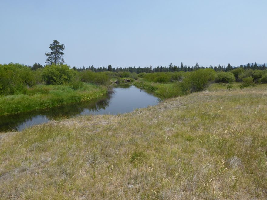 Nice flat level lot 3.33 acres in the Lazy Acres Rivers South subdivision in La Pine. Sits directly on the little Deschutes river, enjoy mountain views, and paved roads throughout the entire neighborhood. Walking distance to Quail Run golf course, easy access to La Pine State Park, lakes, and Sunriver. A dream lot for the outdoor enthusiast.