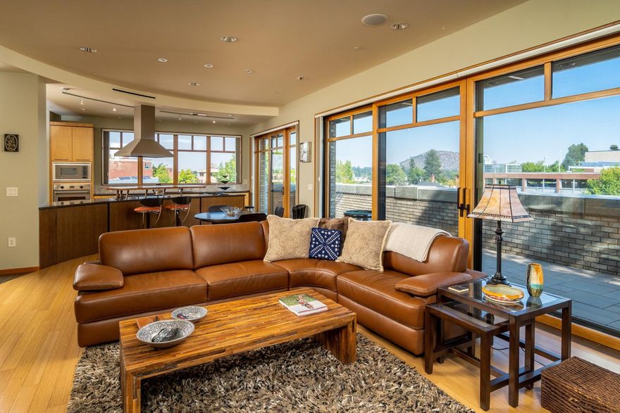 Experience living in the heart of downtown Bend in this fabulous three-bedroom, two-bath condo. This Bond Street stunner boasts 2,582 square feet of modern charm, just steps away from the best restaurants, shops, and cafés that Bend has to offer. A private, secure elevator opens up into a gorgeous, spacious floor plan - featuring plenty of natural light, with large, glass sliding doors leading from the kitchen, living room and master bedroom to a private patio. With ample room for entertaining both inside and out, this amazing condo features an additional, private rooftop patio space available only to tenants, with a gas grill, multiple outdoor seating areas and fantastic views! Private parking garage for the owners of the building with 2 dedicated parking spaces and storage rooms.