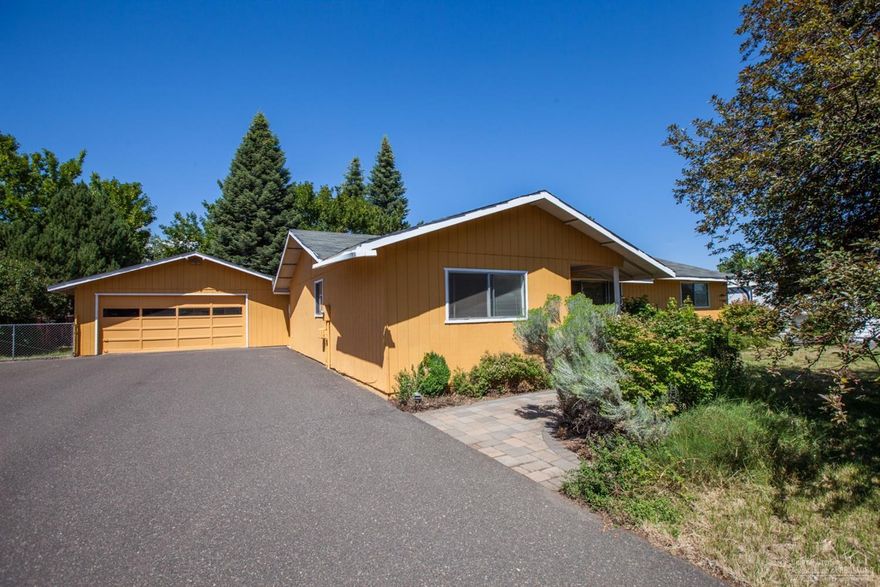 Enjoy a slice of country living in this classic ranch home on the edge of town. Located at the end of a dead end cul de sac, this 1/2 acre lot boasts plenty of room for your toys and RV. The spacious garden includes an insulated greenhouse, over a 1/4acre of irrigation with apple, peach and maple trees, a strawberry patch and much more room to grow. This single level home includes a spacious master bedroom, open kitchen and a classic ranch floor plan. A quaint and private gem that's truly something special.