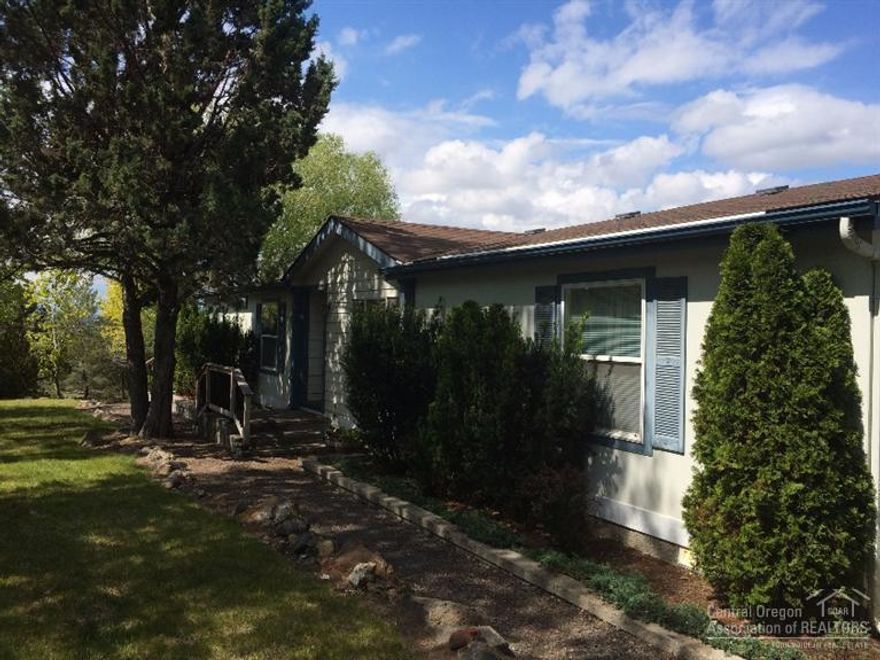 Beautifully landscaped home in Crooked River Ranch. This property has outstanding views of the Cascade Mountains and plenty of privacy. Large composite deck with covered area to enjoy the views and sunsets. Open floor plan with living room, family room & large windows to bring in the natural light. Bedrooms are on opposite ends which provides extra privacy. This house sits on 1.38 acres with a large 30x36 shop for the toys, and fenced for additional privacy. This home you must see to truly appreciate.