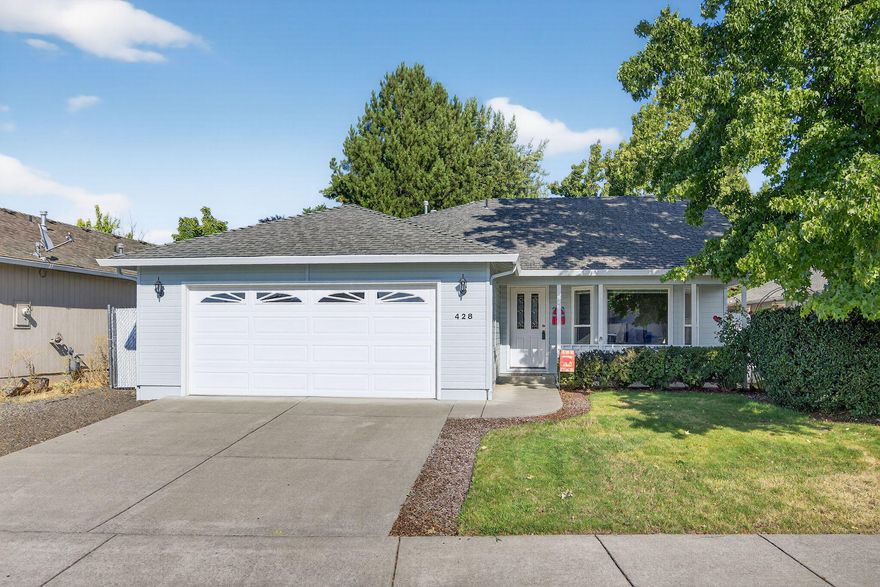 Super clean in & out with proud of ownership shows throughout! Vaulted ceilings in entry and great room with bay windows and a covered front porch. Open floor plan from kitchen with eating bar, lg dining room with coffered ceilings.  Primary suite with coffered ceiling, slider to a cement patio and walk in closet. 2 car finished garage.  Gas forced air heat with central air conditioner. Timed sprinklers in front and back with beautiful landscaping with fenced backyard with separate studio/shop room.