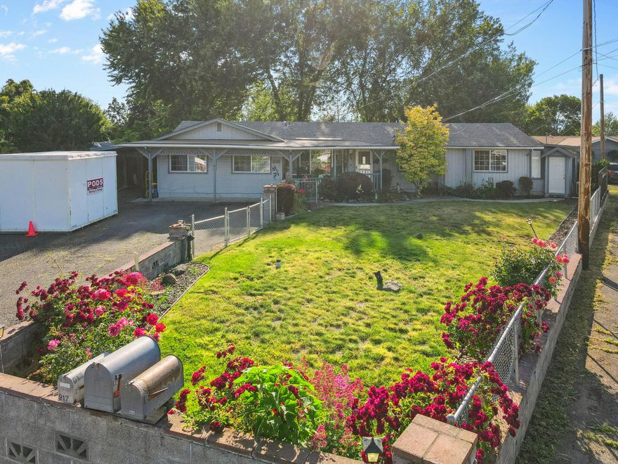 Step into your private sanctuary within the city limits. This beautifully updated five-bedroom home rests on nearly half an acre just past the cul-de-sac for added privacy. Enjoy park-like grounds with two serene man-made ponds, mature landscaping, and a sprawling wrap-around deck, perfect for entertaining, outdoor dining, or peaceful mornings with coffee. There is bonus space perfect for multi-generational living, guest quarters, or a dedicated home office. Upgrades include plantation shutters, cellular blinds, tankless water heater, HVAC with central AC, and a mini split in the bonus space, updated counters, sinks, faucets, flooring, landscaping, irrigation, modern ductwork, and a new walk-in shower. Exterior highlights include a rustic shed, workshop, ample parking, extra-long driveway for 5-6 cars, covered carport, and RV parking with sewer hookup. Blending modern convenience with timeless natural beauty.