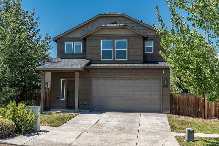 Beautifully updated 3-bedroom, 2.5-bath home perfectly situated on a corner lot near shopping, restaurants, and the Old Mill District. Step inside to discover a stunning, newly remodeled kitchen featuring an oversized island with a sleek waterfall countertop, a Miele induction cooktop, JennAir appliances, and a JennAir wine fridge—an ideal space for cooking and entertaining. The inviting living area offers a remodeled tiled fireplace that creates a warm focal point for gatherings. Upstairs, comfortable bedrooms provide plenty of space for everyone. This move-in ready home blends style, function, and an unbeatable location close to all that Bend has to offer.