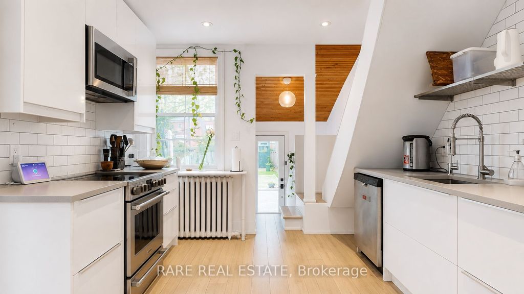 Photo of 48 Redwood Avenue, Toronto, ON M4L 2S6 (MLS # E13150632)