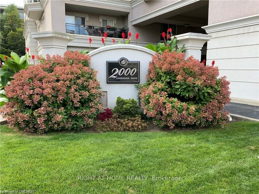 Photo of 2000 Creekside Drive #202, Hamilton, ON L9H 7S7 (MLS # X13094116)