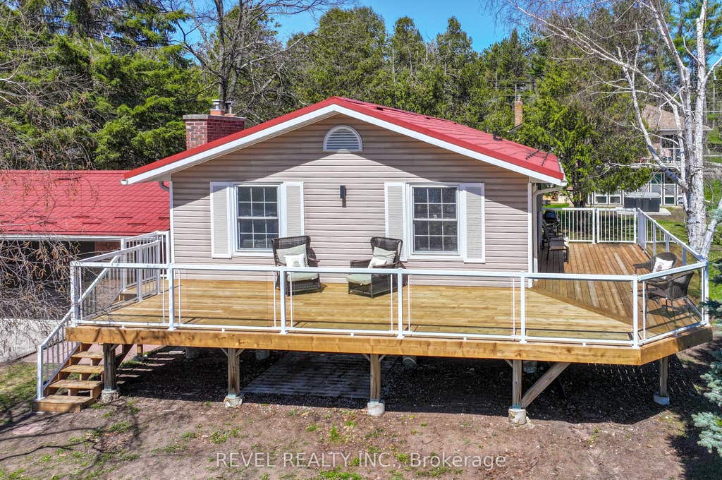 Photo of 13 Pirates Glen Drive, Trent Lakes, ON K0M 1A0 (MLS # X13088162)