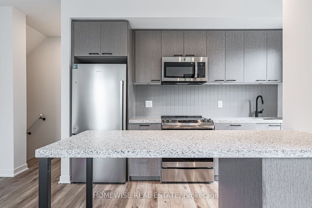 Photo of 20 Ed Clark Gardens #TH8, Toronto, ON M6N 0B5 (MLS # W12662058)