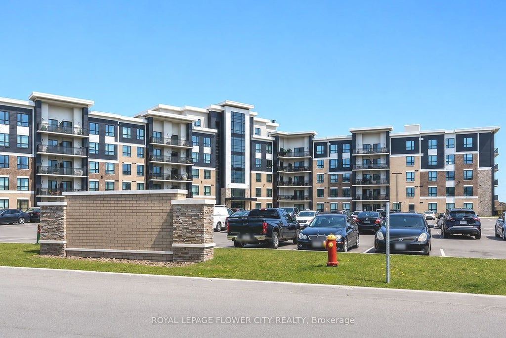Photo of 630 Sauve Street #404, Milton, ON L9T 9A6 (MLS # W13856564)