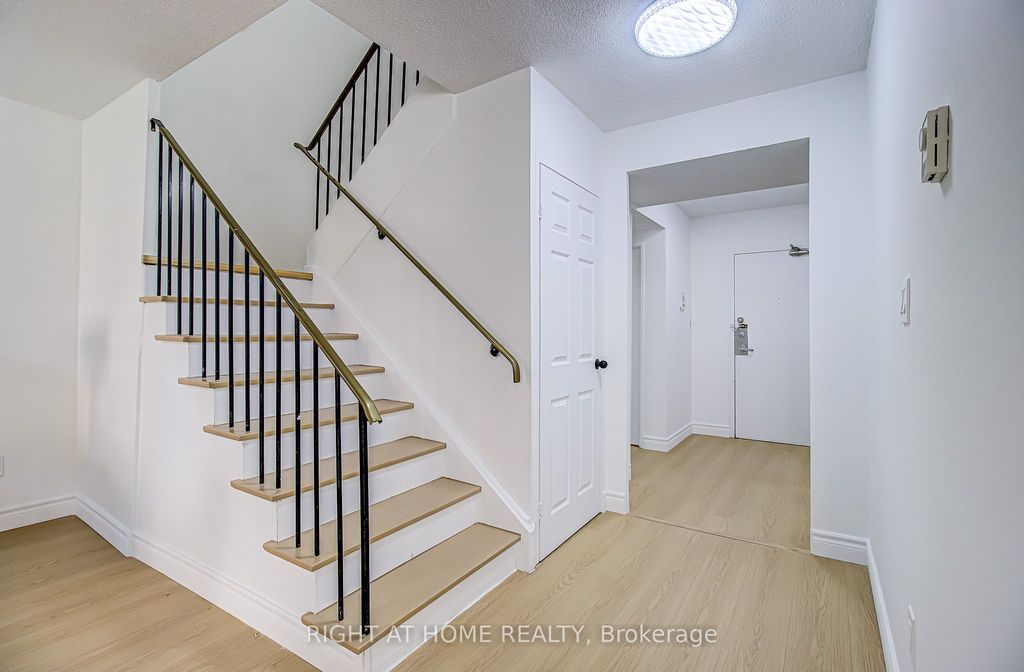 Photo of 8 Crescent Town Road #409, Toronto, ON M4C 5L3 (MLS # E13119648)