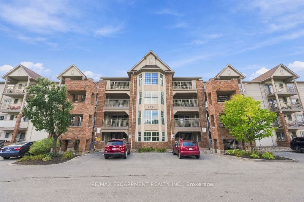 Photo of 4025 KILMER Drive #310, Burlington, ON L7M 4M5 (MLS # W13825068)