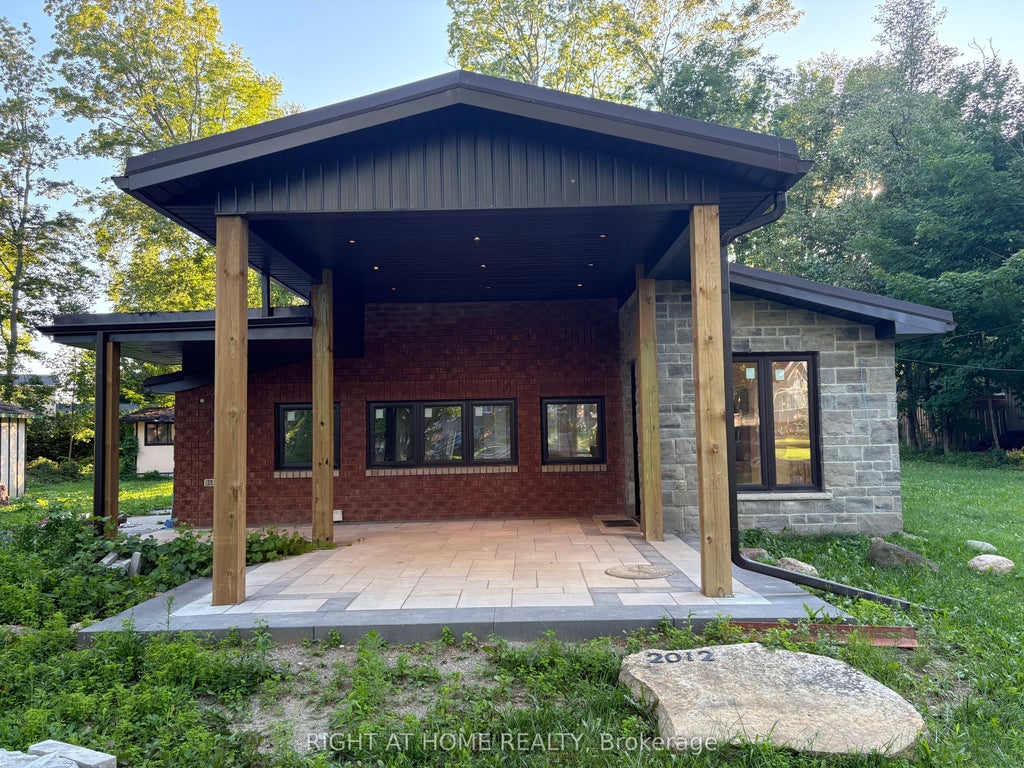 Photo of 2012 Inglewood Drive, Innisfil, ON L9S 1Z1 (MLS # N13750296)
