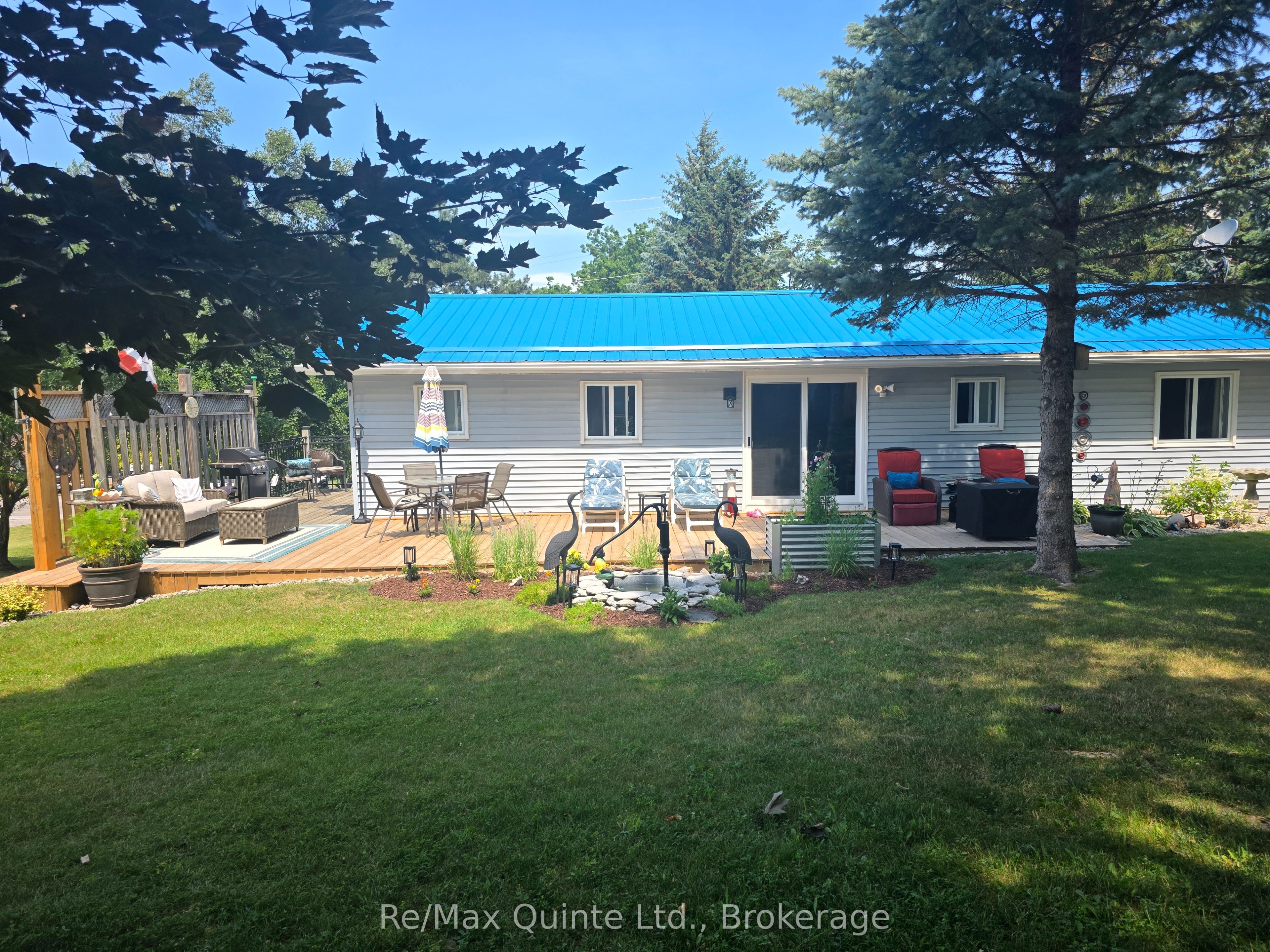 Back of home with large deck