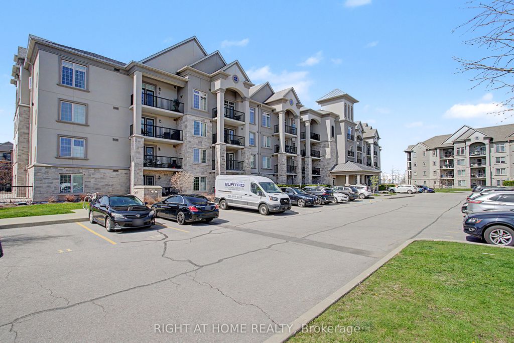 Photo of 1460 Main Street E #404, Milton, ON L9T 8W5 (MLS # W13108150)