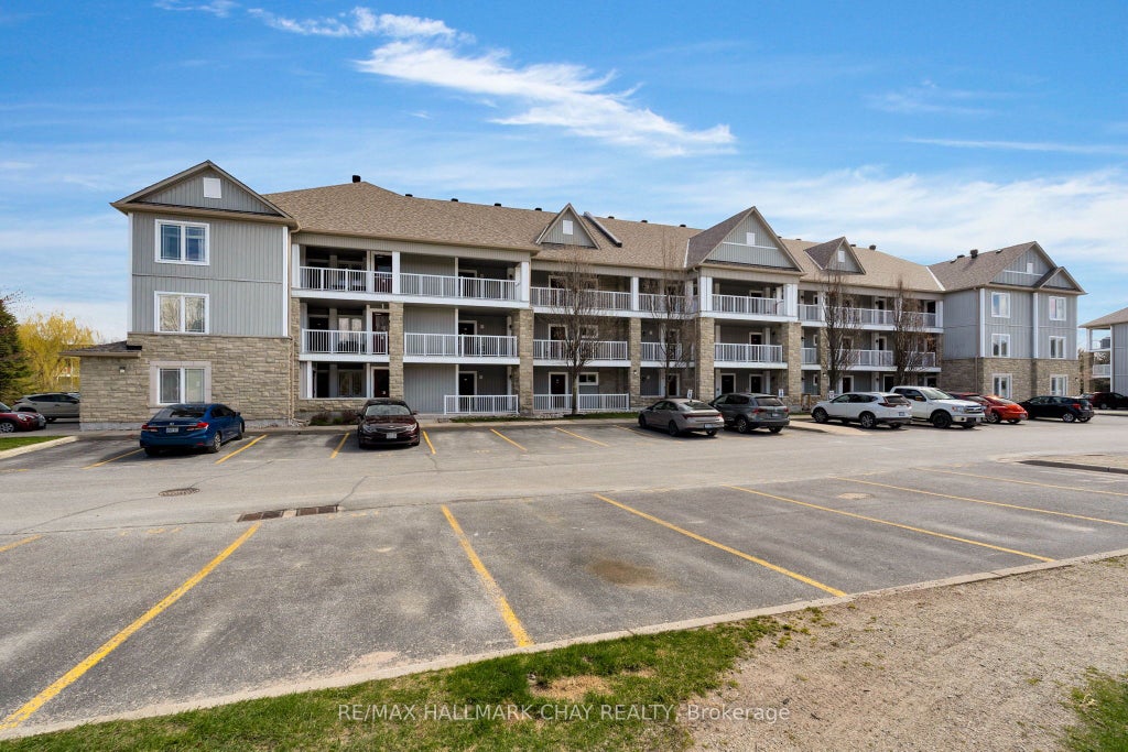 Photo of 40 Mulligan Lane #307, Wasaga Beach, ON L9Z 0C5 (MLS # S13629348)