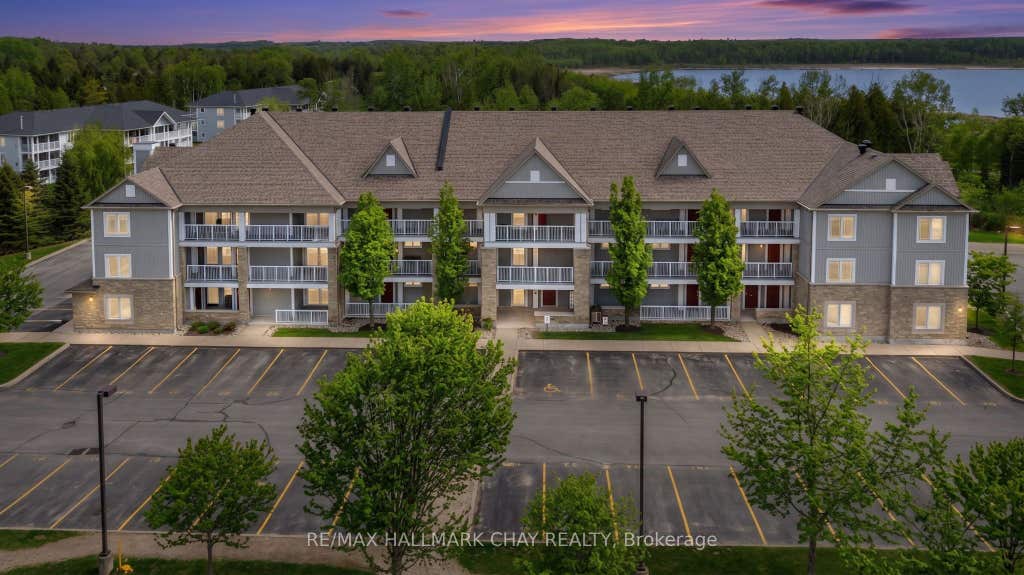 Photo of 40 Mulligan Lane #307, Wasaga Beach, ON L9Z 0C5 (MLS # S13629348)