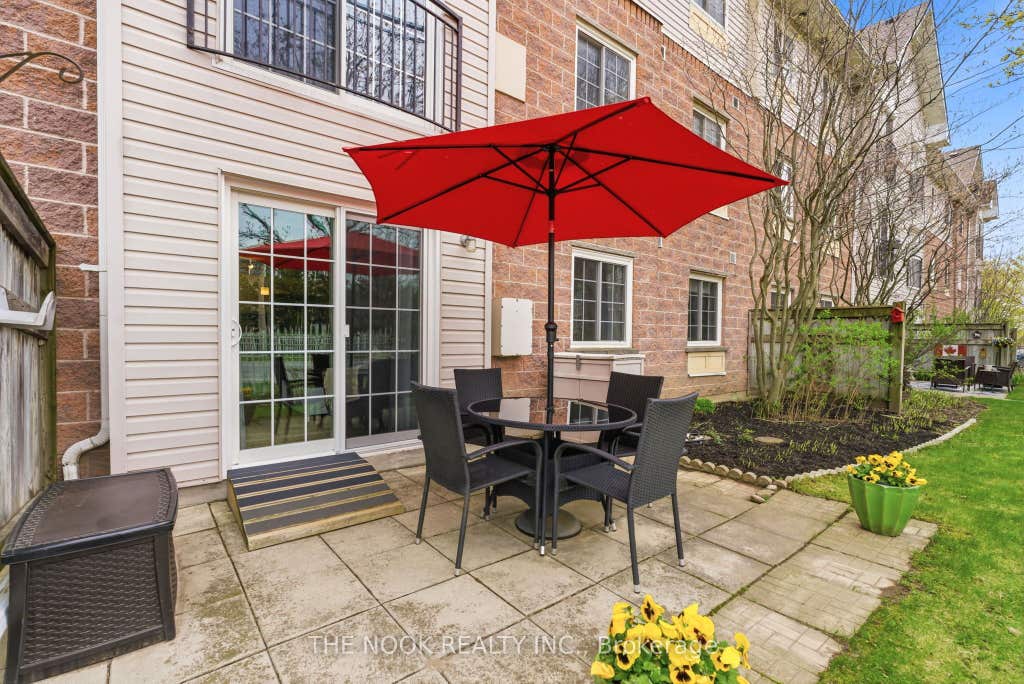 Photo of 91 Aspen Springs Drive #107, Clarington, ON L1C 5J9 (MLS # E13094950)