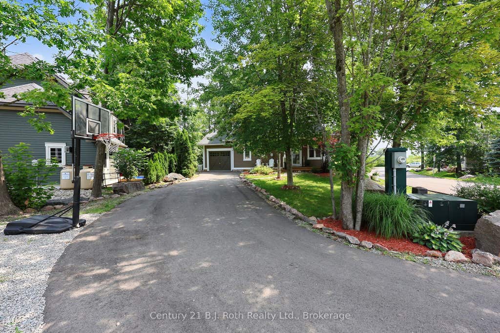 Photo of 37 Country Trail, Georgian Bay, ON L0K 1S0 (MLS # X13679844)