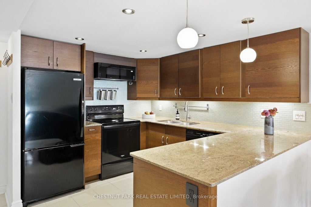 Photo of 65 Scadding Avenue #211, Toronto, ON M5A 4L1 (MLS # C13836486)