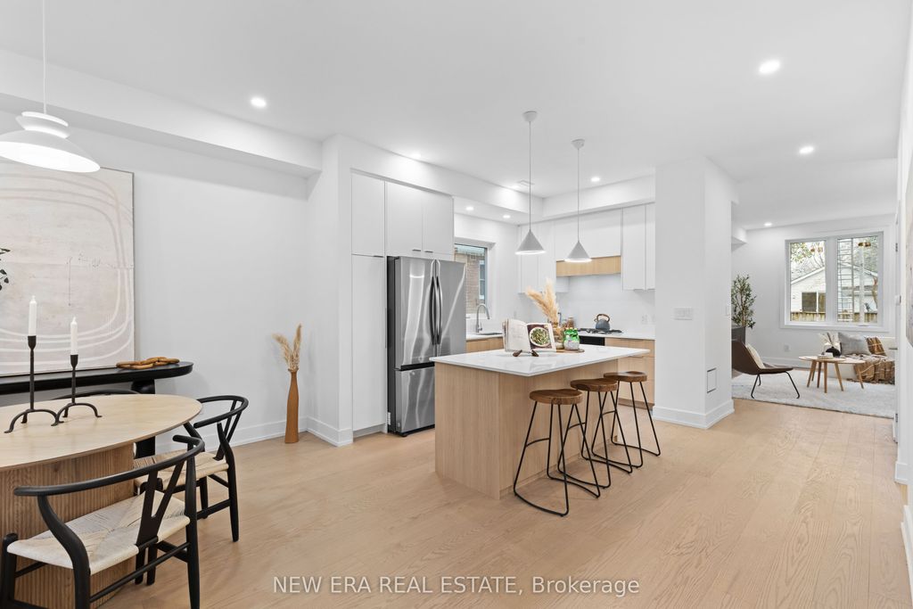 Photo of 148 Rhodes Avenue, Toronto, ON M4L 3A1 (MLS # E12582694)