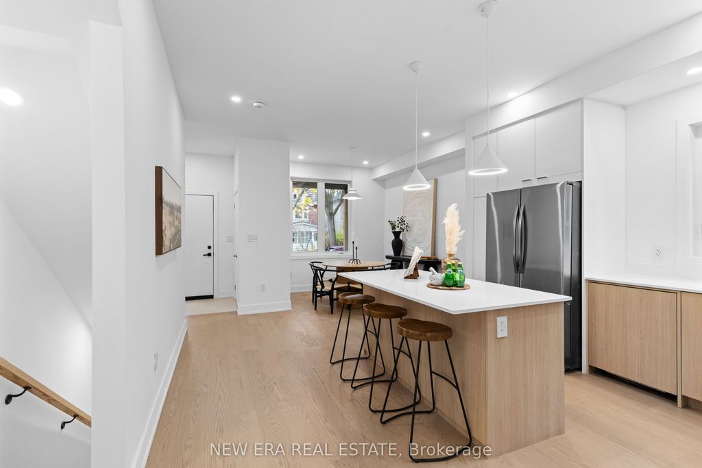 Photo of 148 Rhodes Avenue, Toronto, ON M4L 3A1 (MLS # E12582694)