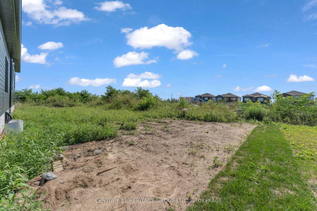 Photo of 56 Dusenbury Drive, Loyalist, ON K0H 1N0 (MLS # X13653020)