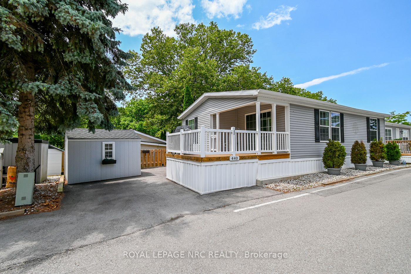 Adorable! The shed is included & one parking spot