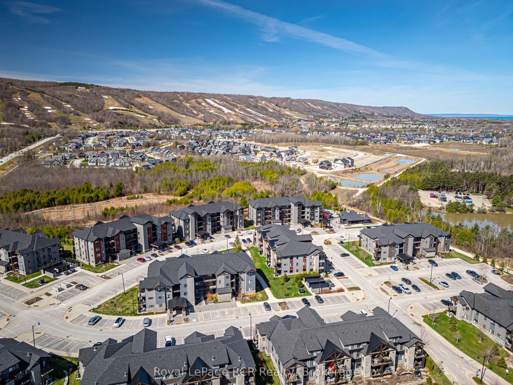 Photo of 11 Beckwith Lane #102, Blue Mountains, ON L9Y 0C7 (MLS # X13131334)