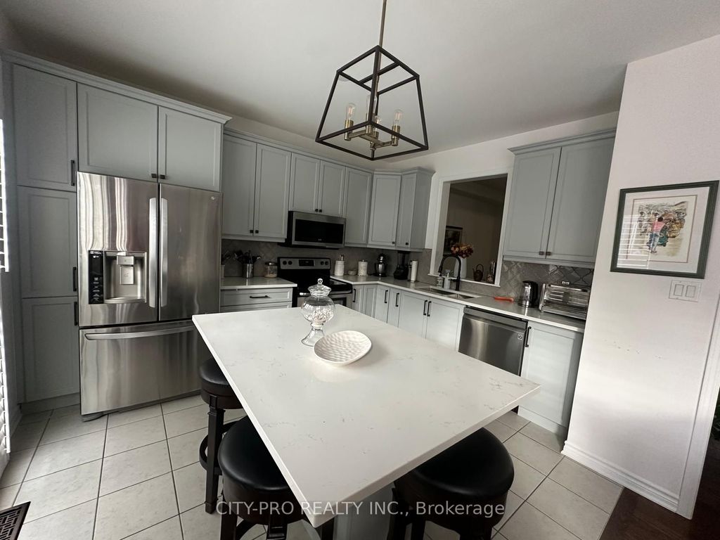 Photo of 439 Etheridge Avenue, Milton, ON L9E 0B3 (MLS # W13066488)