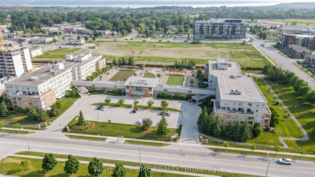 Photo of 94 Dean Avenue #402, Barrie, ON L4N 0M3 (MLS # S12591182)