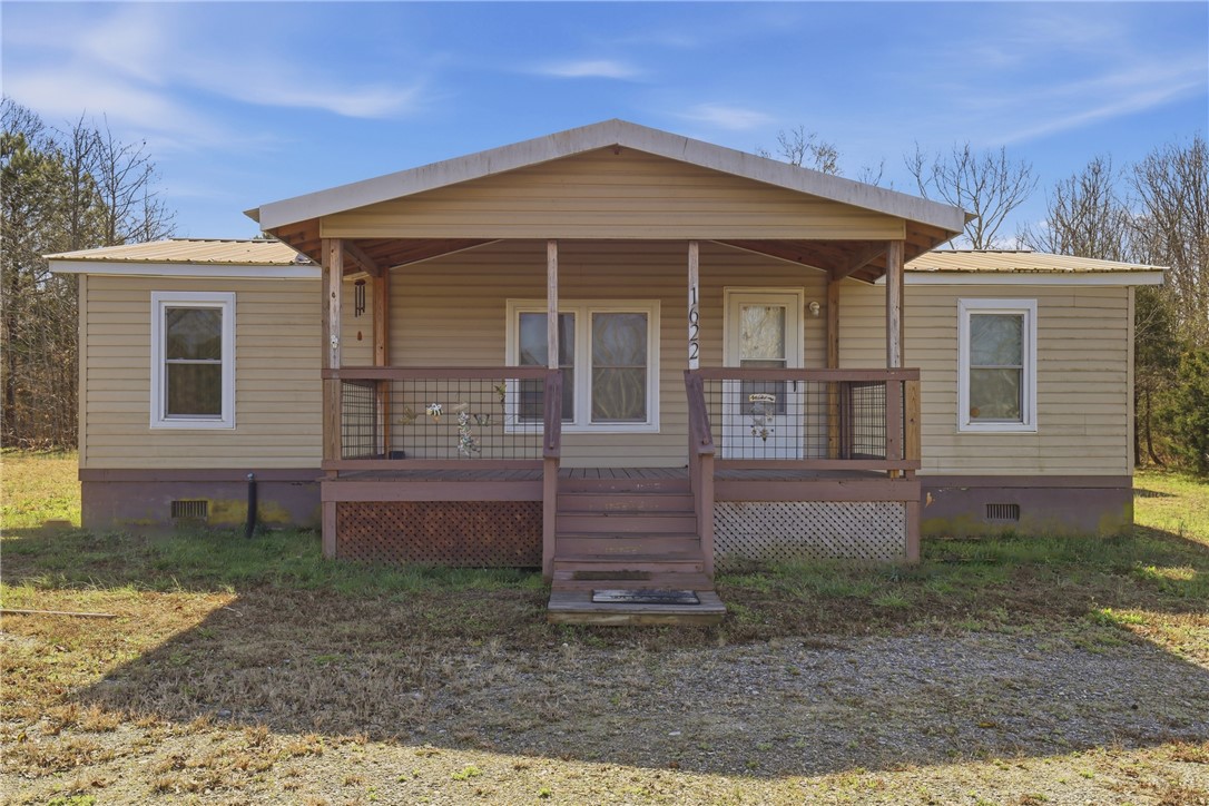 This charming home offers a welcoming facade with